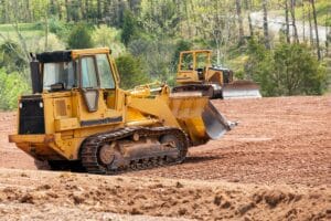 yellow earth moving digger